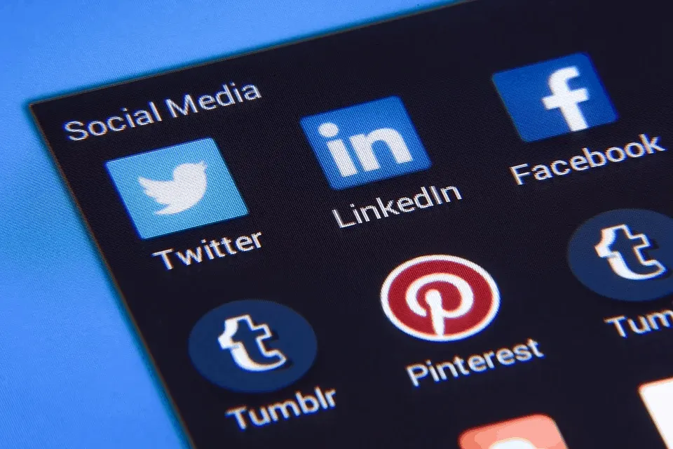 Social media app icons including Twitter, LinkedIn, Facebook, Pinterest, and Tumblr on a digital device screen.